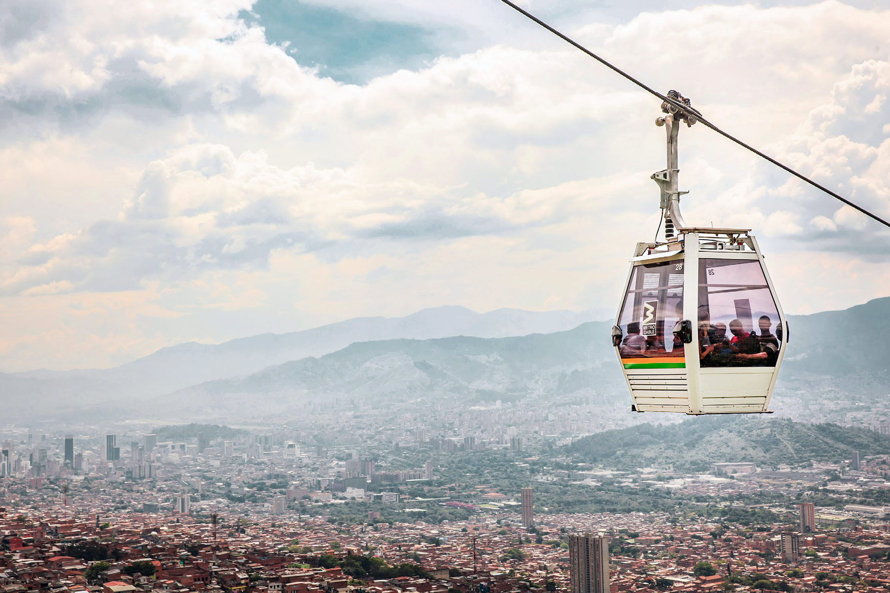 Metrocable in Medellin, Colombia. Detachable monocable gondola lift as mass urban transportation.