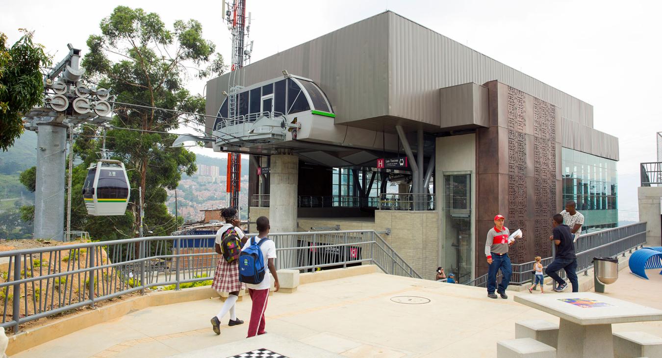 Station "Los Torres." Metrocable in Medellin, Colombia. Detachable monocable gondola lift as mass urban transportation.